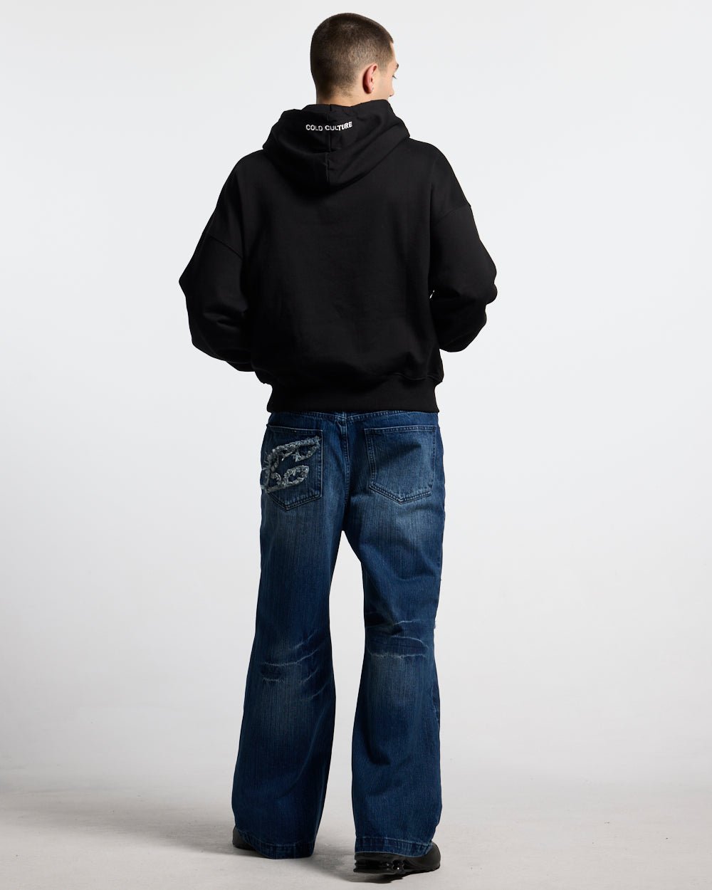 STARS HOODIE BLACK - black oversized hoodie, back view on male model - Cold Culture #man