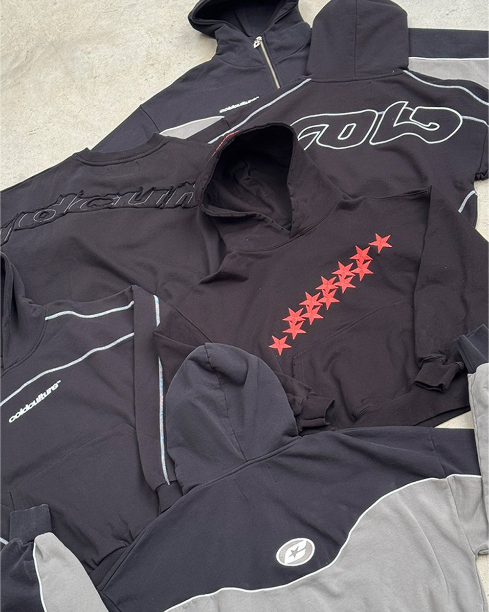 STARS HOODIE BLACK & RED - black hoodie with red stars, flat lay with matching pieces - Cold Culture