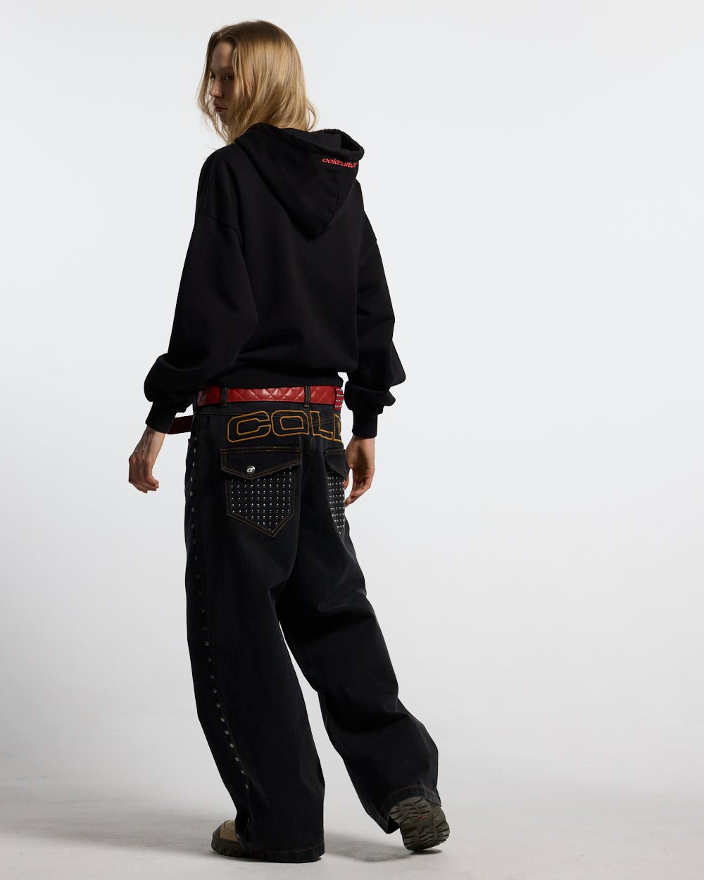STARS HOODIE BLACK & RED - black hoodie with red stars, back view on female model - Cold Culture #woman