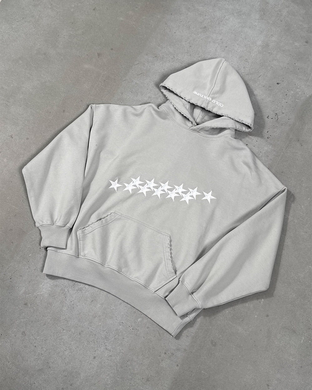 STARS HOODIE PALE GREY - pale grey star print hoodie, flat lay - Cold Culture