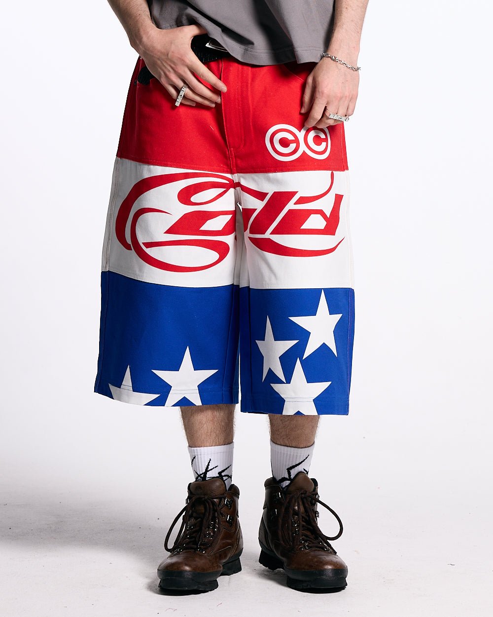 STARS JORTS RED WHITE AND BLUE - red white blue star print shorts, front view on male model - Cold Culture