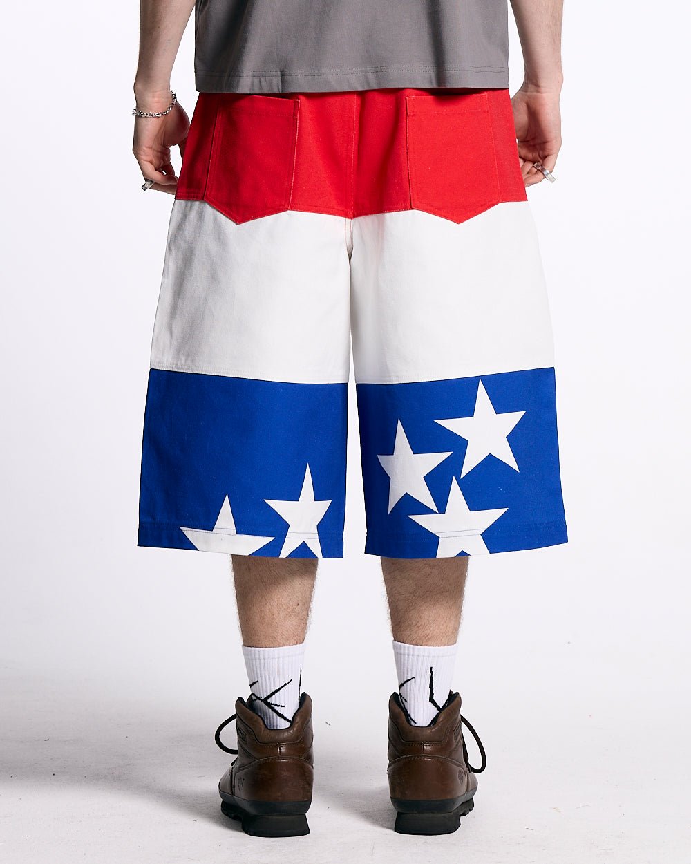 STARS JORTS RED WHITE AND BLUE - red white blue star print shorts, back view on male model - Cold Culture