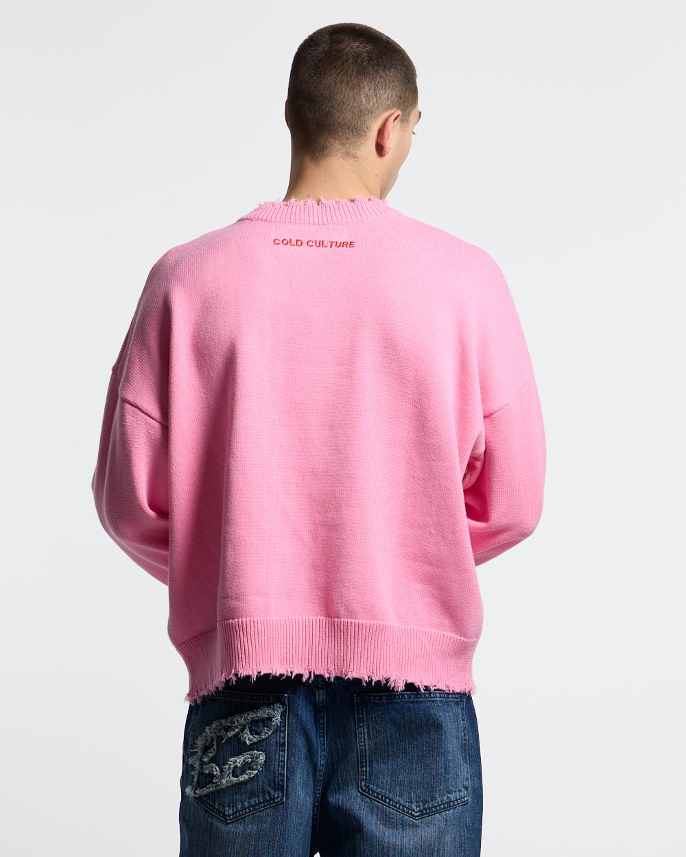 STARS KNIT PINK - pink star print knit sweater, back view on male model - Cold Culture #man
