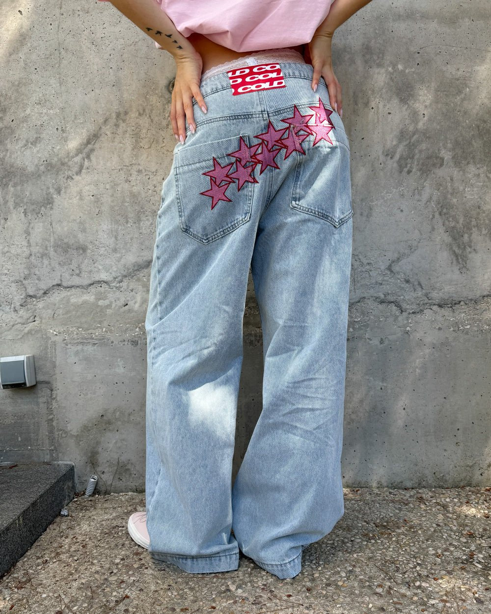 STARS V2 PANTS LIGHT BLUE DENIM - light blue baggy denim pants, back view on female model - Cold Culture #woman