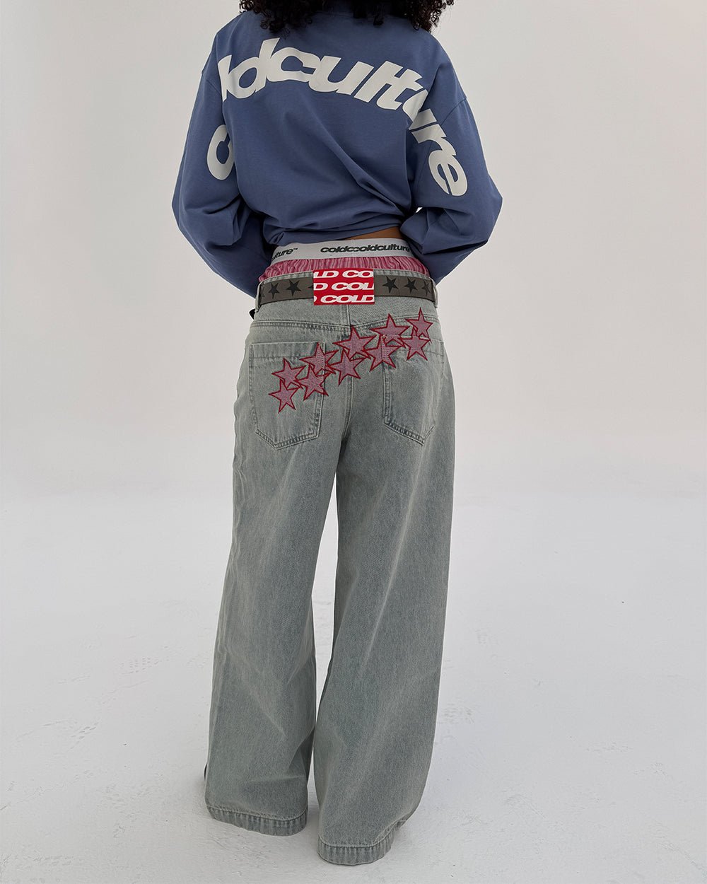 STARS V2 PANTS LIGHT BLUE DENIM - light blue baggy denim pants, back view on female model - Cold Culture #woman