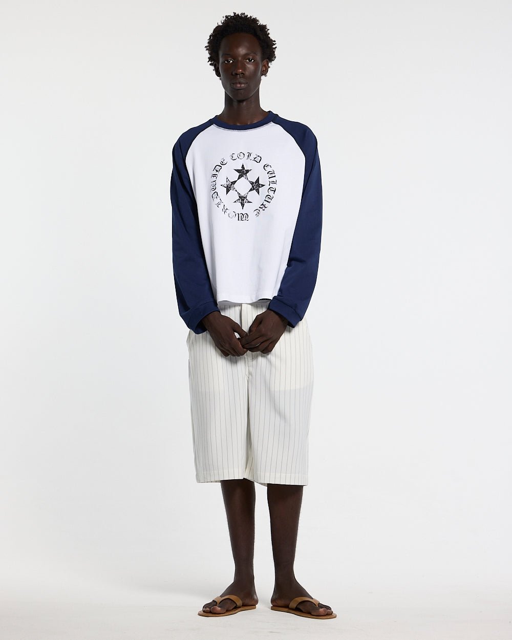 STARSHIELD LONGSLEEVE BLUE - white and navy raglan longsleeve tee, front view on male model - Cold Culture #man