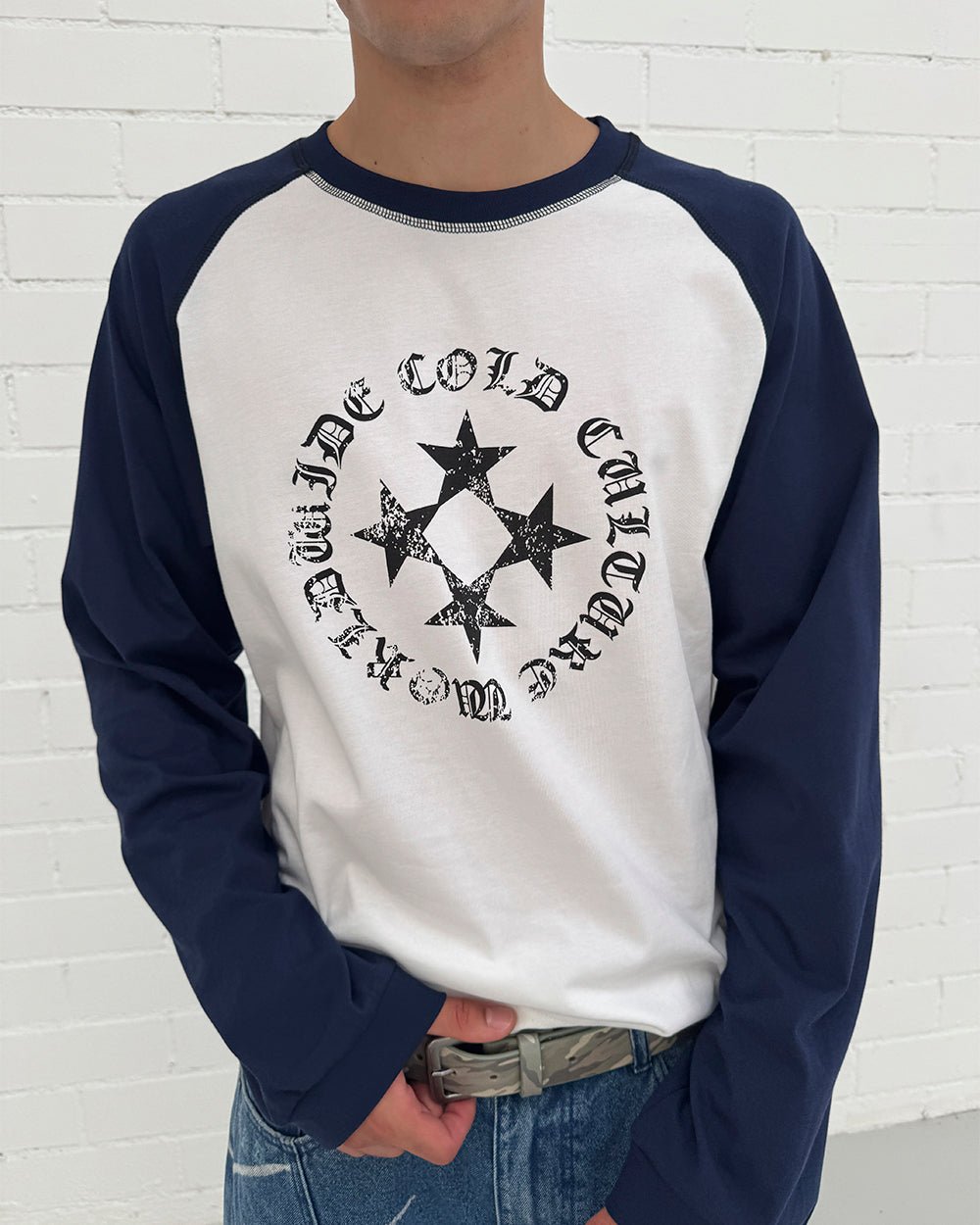 STARSHIELD LONGSLEEVE BLUE - white and navy raglan longsleeve tee, on model close-up - Cold Culture