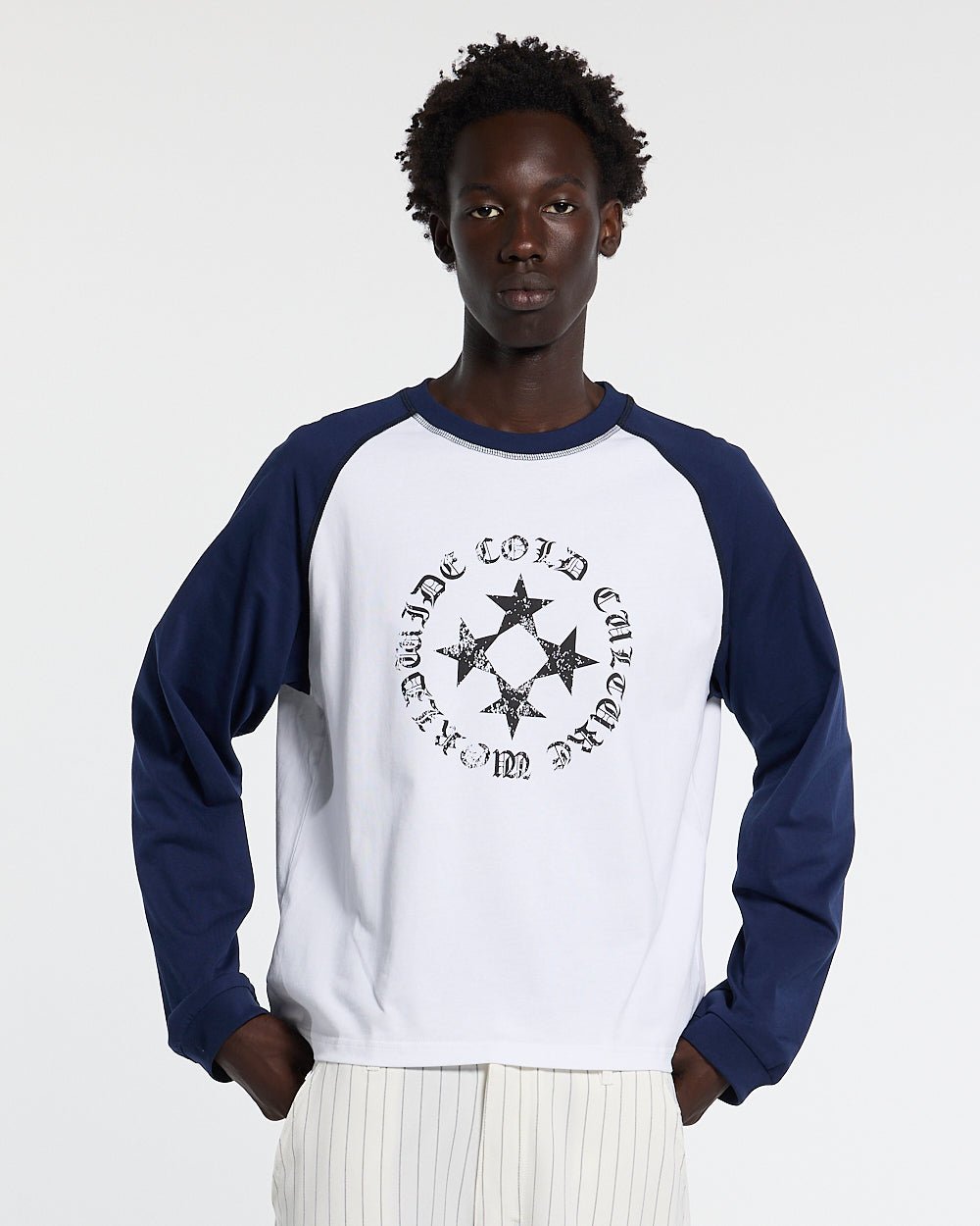 STARSHIELD LONGSLEEVE BLUE - white and navy raglan longsleeve tee, front view on male model - Cold Culture #man