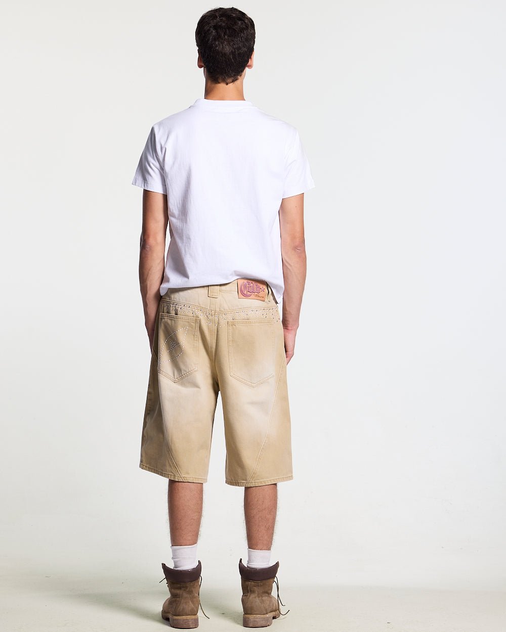 STARSTRUCK TEE WHITE - white studded logo tee, back view on male model - Cold Culture #man