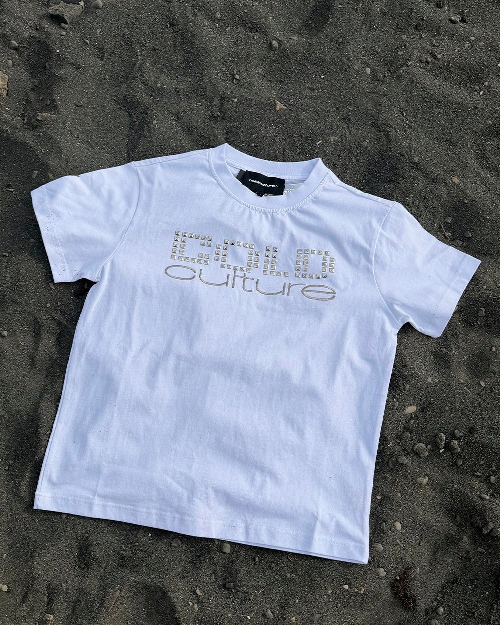 STARSTRUCK TEE WHITE - white studded logo tee, flat lay - Cold Culture