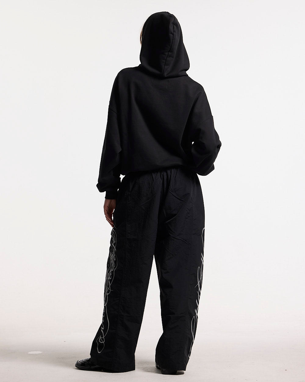 STEEL HOODIE BLACK - black oversized hoodie, back view on female model - Cold Culture #woman