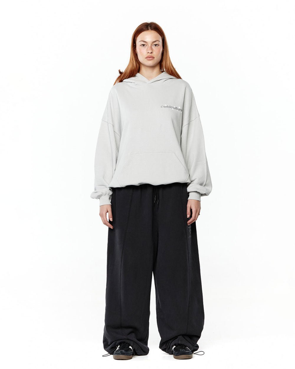 STELLAR HOODIE LIGHT GREY - light grey oversized hoodie, front view on female model - Cold Culture #woman