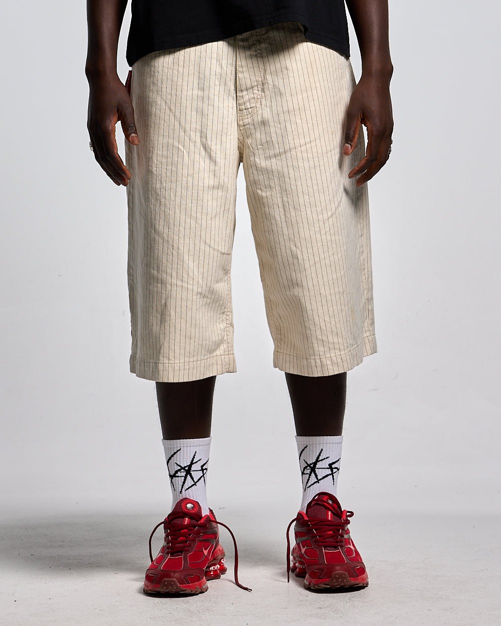 STRIPE FADE JORTS WHITE - off-white pinstripe baggy shorts, front view on male model - Cold Culture
