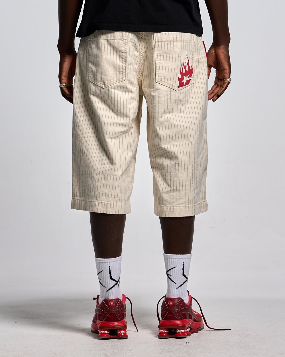 STRIPE FADE JORTS WHITE - off-white pinstripe baggy shorts, back view on male model - Cold Culture