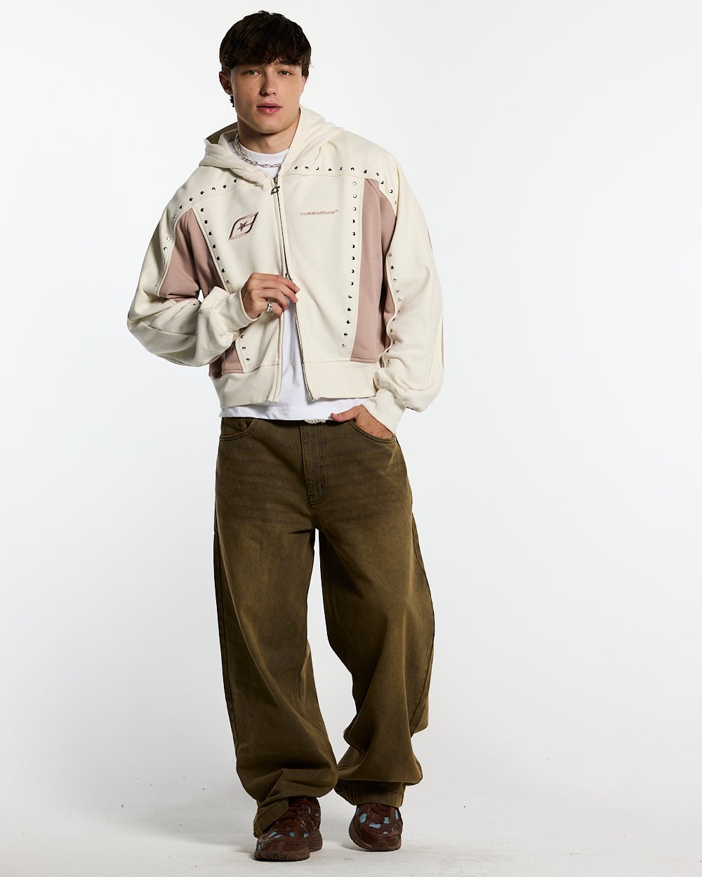 STUD ZIP HOODIE LIGHT GREY - cream and pink studded zip-up hoodie, front view on male model - Cold Culture #man