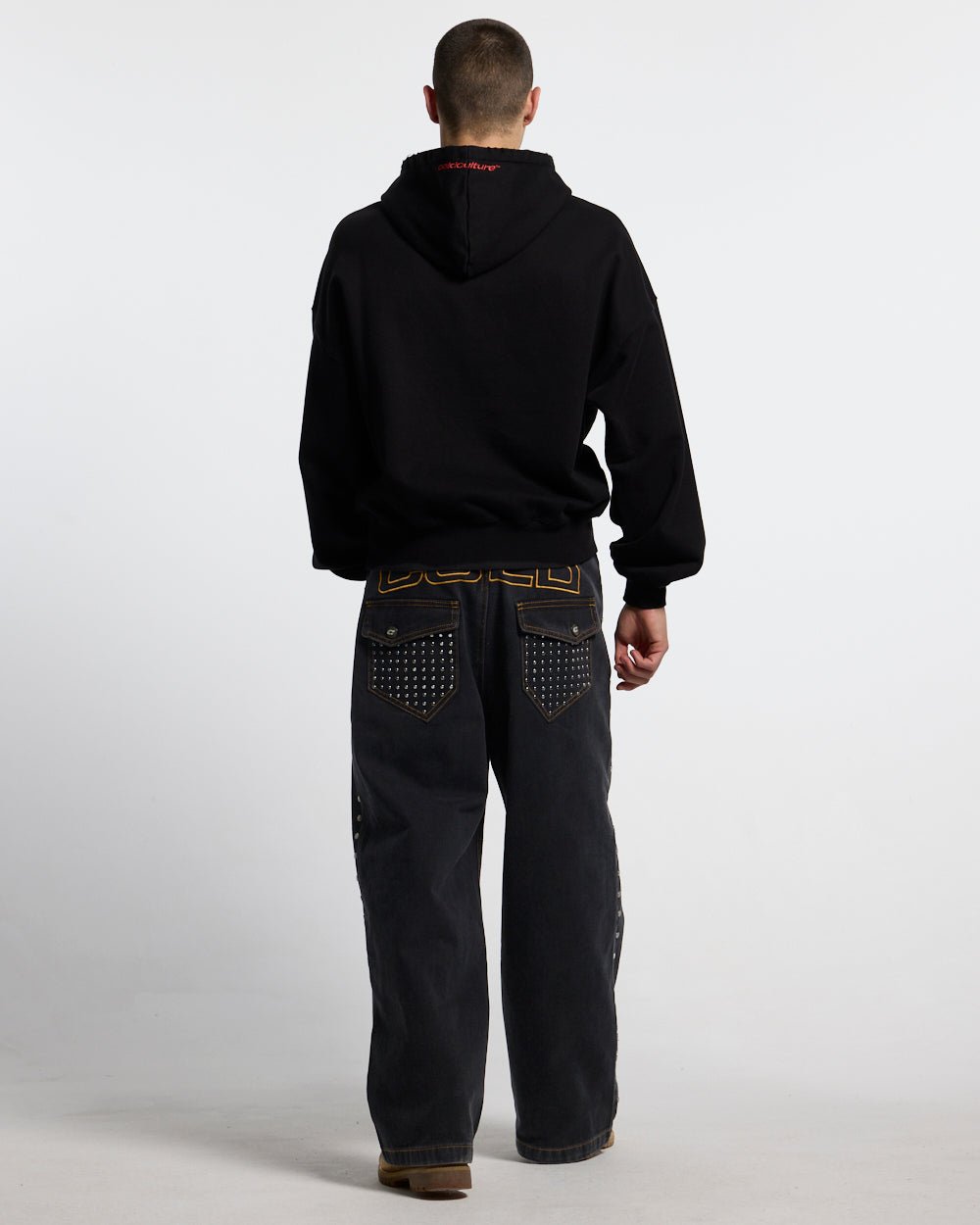 STUDS PANTS BLACK DENIM - black studded denim pants, back view on male model - Cold Culture