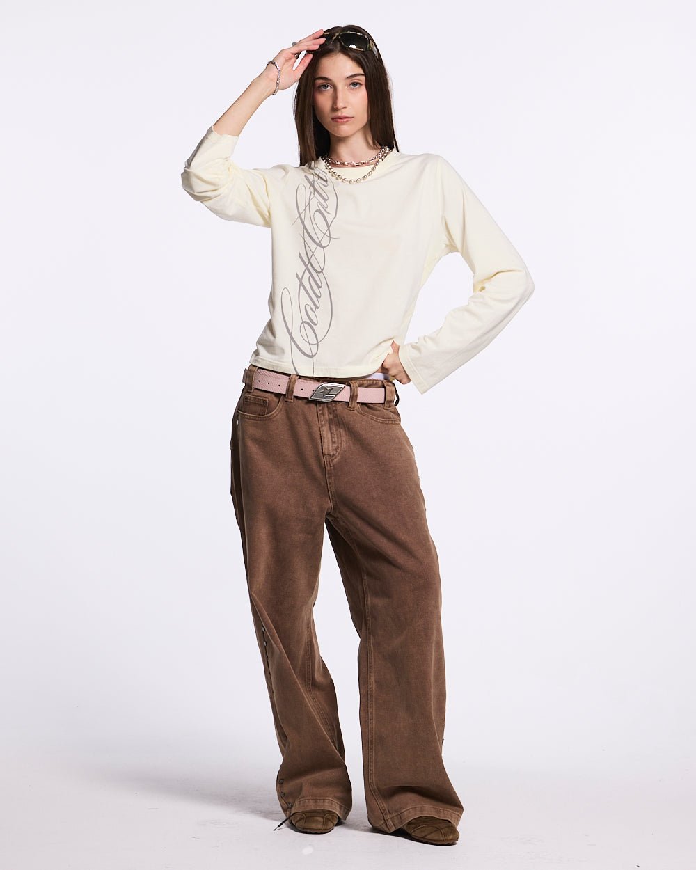 STUDS PANTS BROWN DENIM - brown studded denim pants, front view on female model - Cold Culture #woman