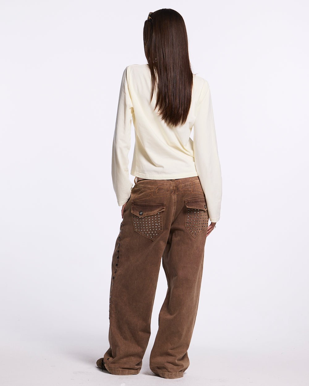 STUDS PANTS BROWN DENIM - brown studded denim pants, back view on female model - Cold Culture #woman