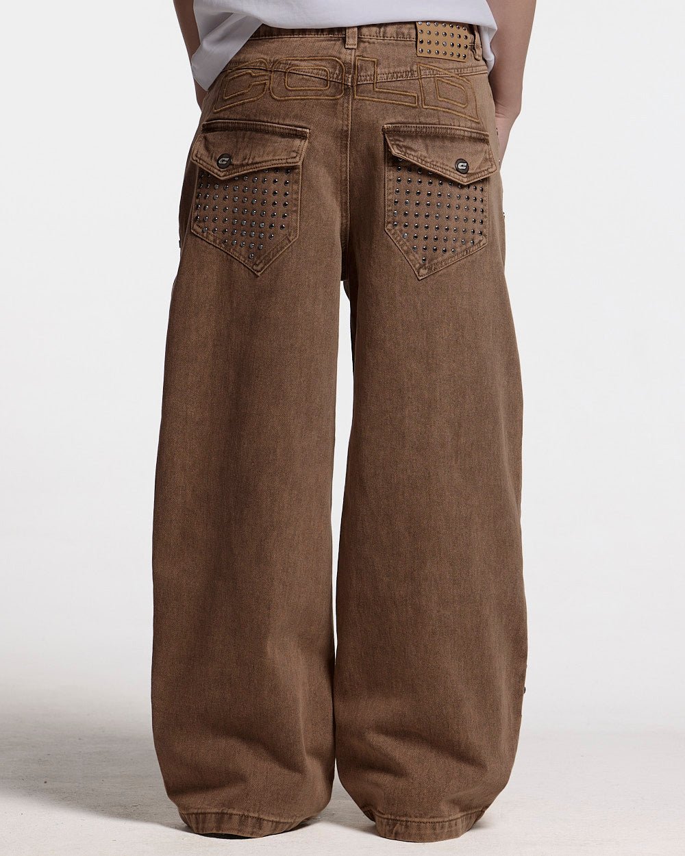 STUDS PANTS BROWN DENIM - brown studded denim pants, back view on female model - Cold Culture #woman