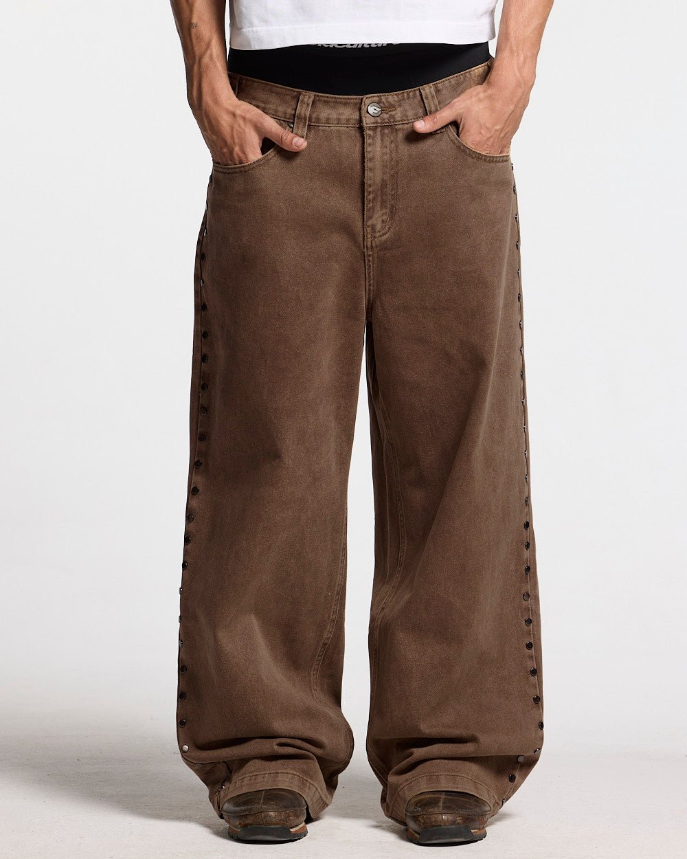 STUDS PANTS BROWN DENIM - brown studded denim pants, front view on male model - Cold Culture