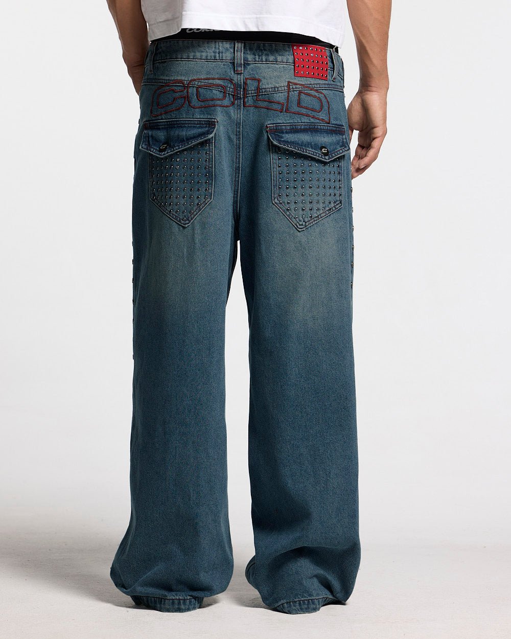 STUDS PANTS LIGHT BLUE DENIM - washed blue studded denim pants, back view on male model - Cold Culture