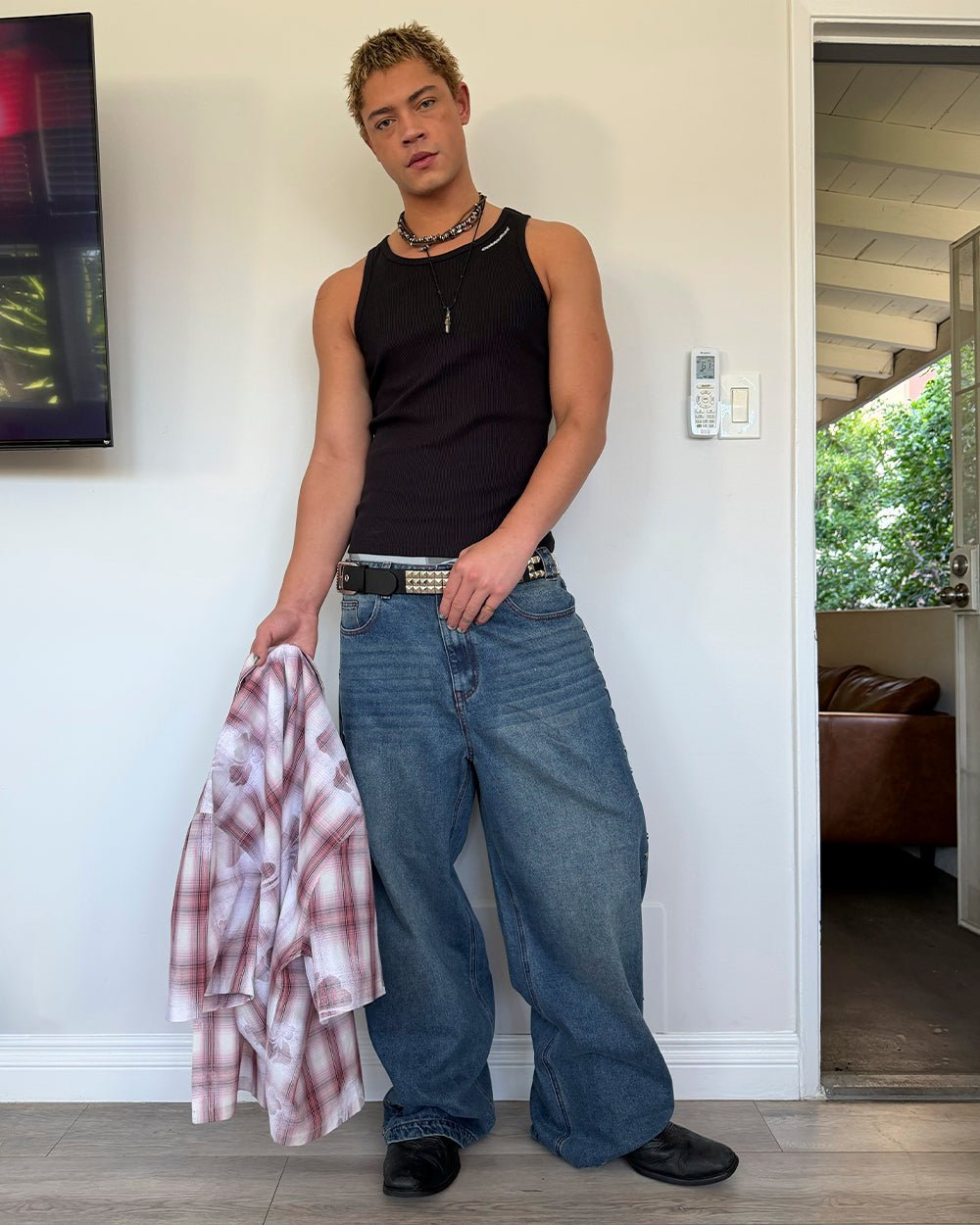 STUDS PANTS LIGHT BLUE DENIM - washed blue studded denim pants, street style shot - Cold Culture