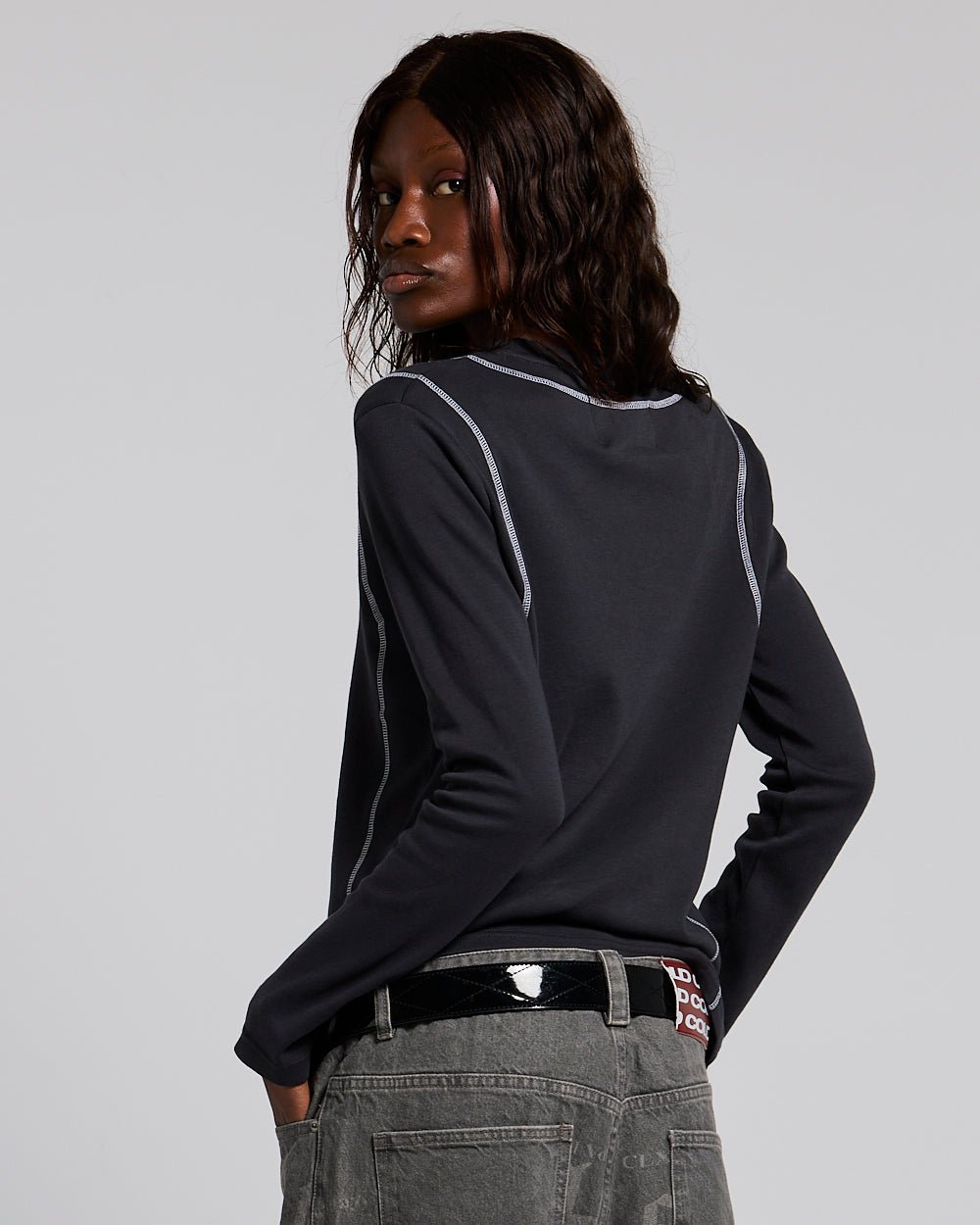 SURVIVOR LONGSLEEVE BLACK - black contrast stitch longsleeve tee, back view on female model - Cold Culture #woman