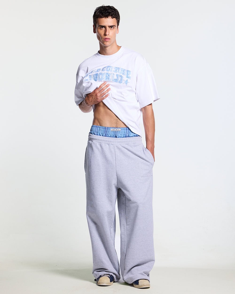 TAKE A PEAK SWEATPANTS HEATHER GREY - grey sweatpants with plaid trim, front view on male model - Cold Culture #man