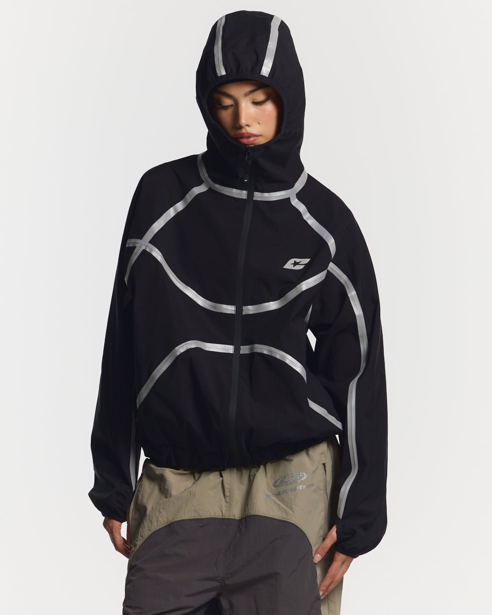 TAKE OFF LIGHTWEIGHT JACKET BLACK - black reflective trim jacket, front view on female model - Cold Culture #woman