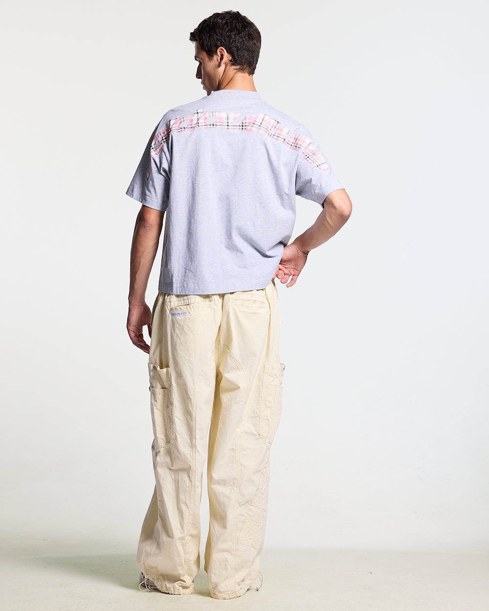 TARTAN DISTRESS CURVED TEE GREY - grey tartan detail tee, back view on male model - Cold Culture #man