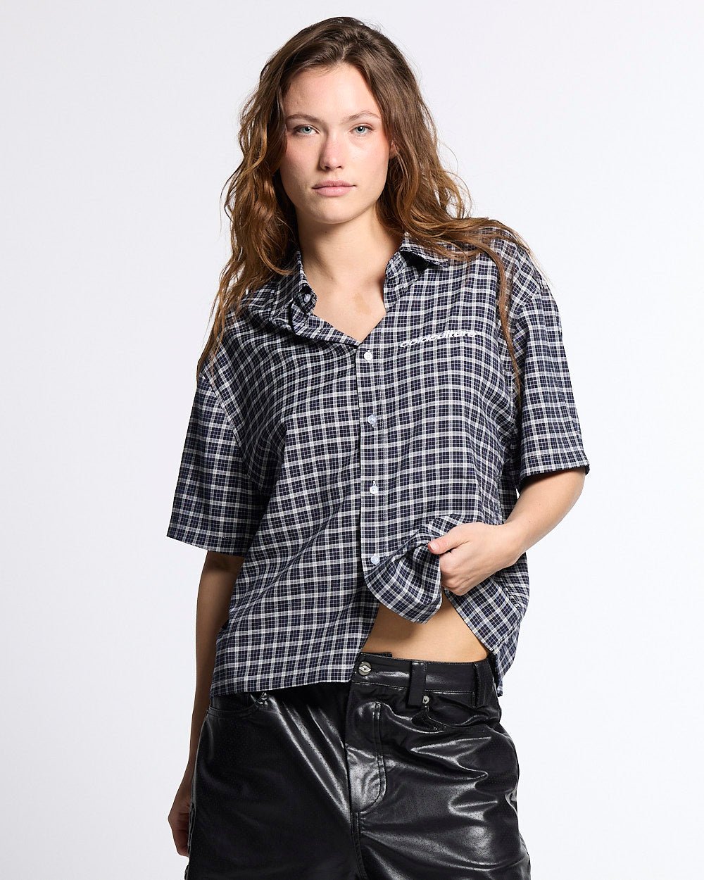 TARTAN SCRIPT SHIRT BLACK - black plaid short sleeve shirt, front view on female model - Cold Culture #woman