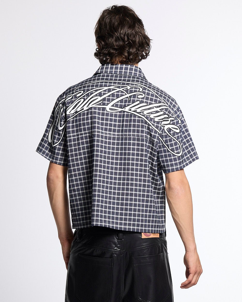 TARTAN SCRIPT SHIRT BLACK - black plaid short sleeve shirt, back view on male model - Cold Culture #man