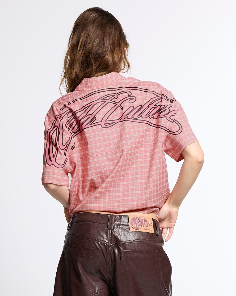 TARTAN SCRIPT SHIRT PINK - pink plaid short sleeve shirt, back view on female model - Cold Culture #woman