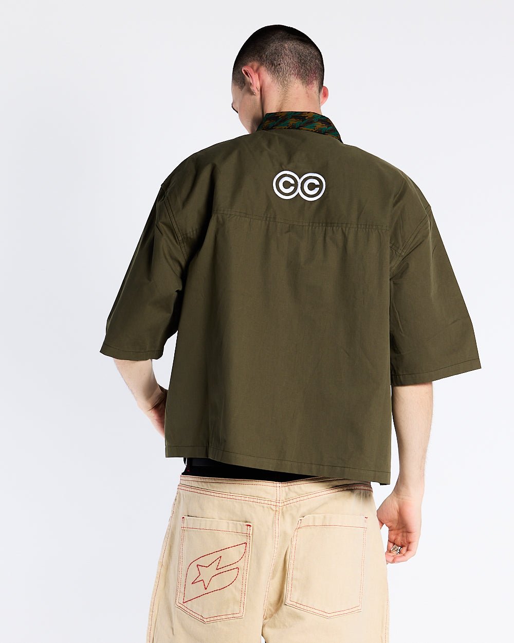 TERRA SHIRT CAPER GREEN - olive green short sleeve shirt, back view on male model - Cold Culture #man