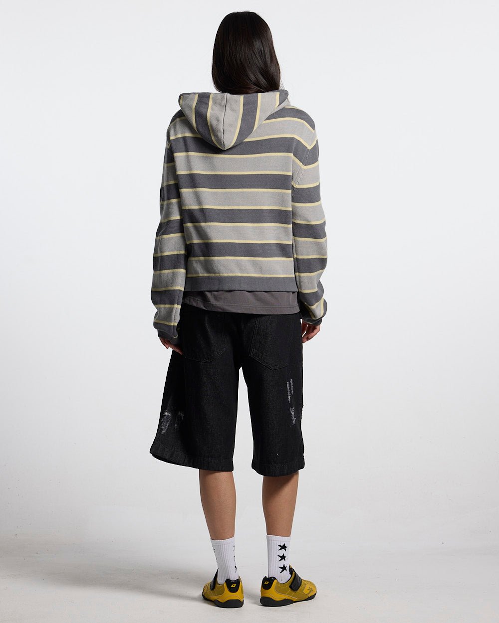 TOXIC SHORTS BLACK DENIM - black distressed denim shorts, back view on female model - Cold Culture #woman