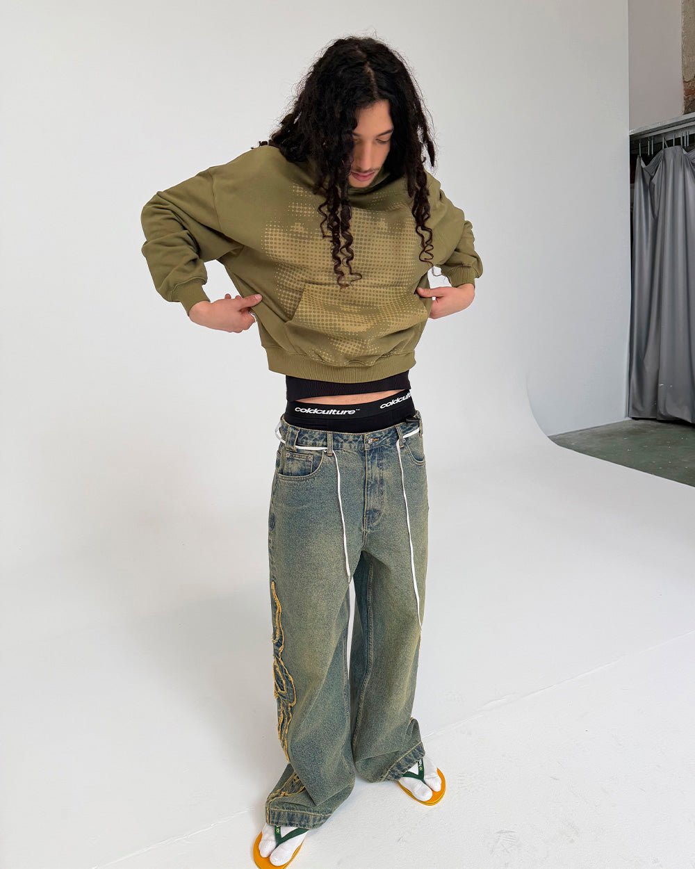 TRIBAL DISTRESSED V2 PANTS GREEN WASHED DENIM - distressed green denim pants, front view on male model - Cold Culture #man