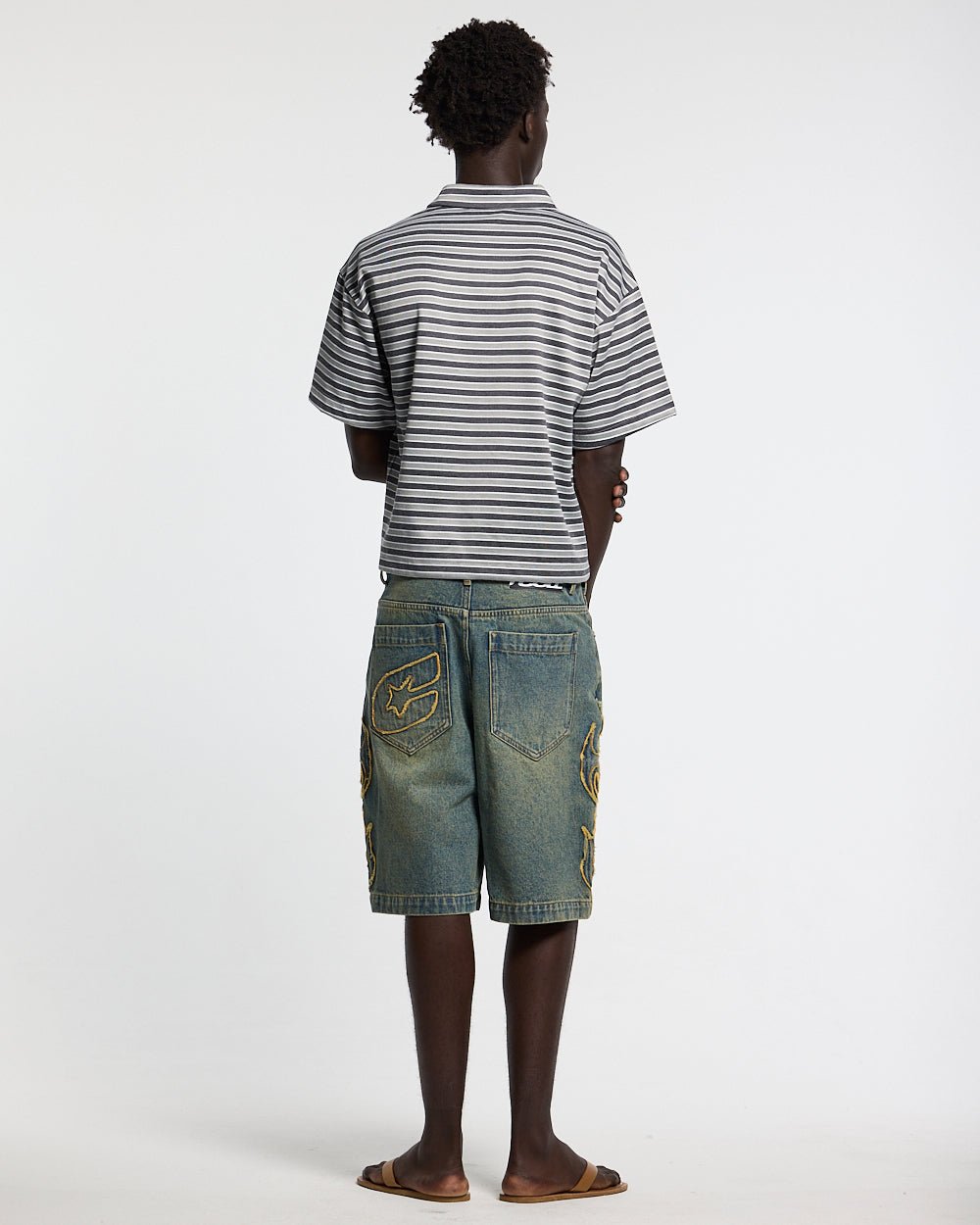 TRIBAL DISTRESSED V2 SHORTS GREEN - green washed denim shorts, back view on male model - Cold Culture #man