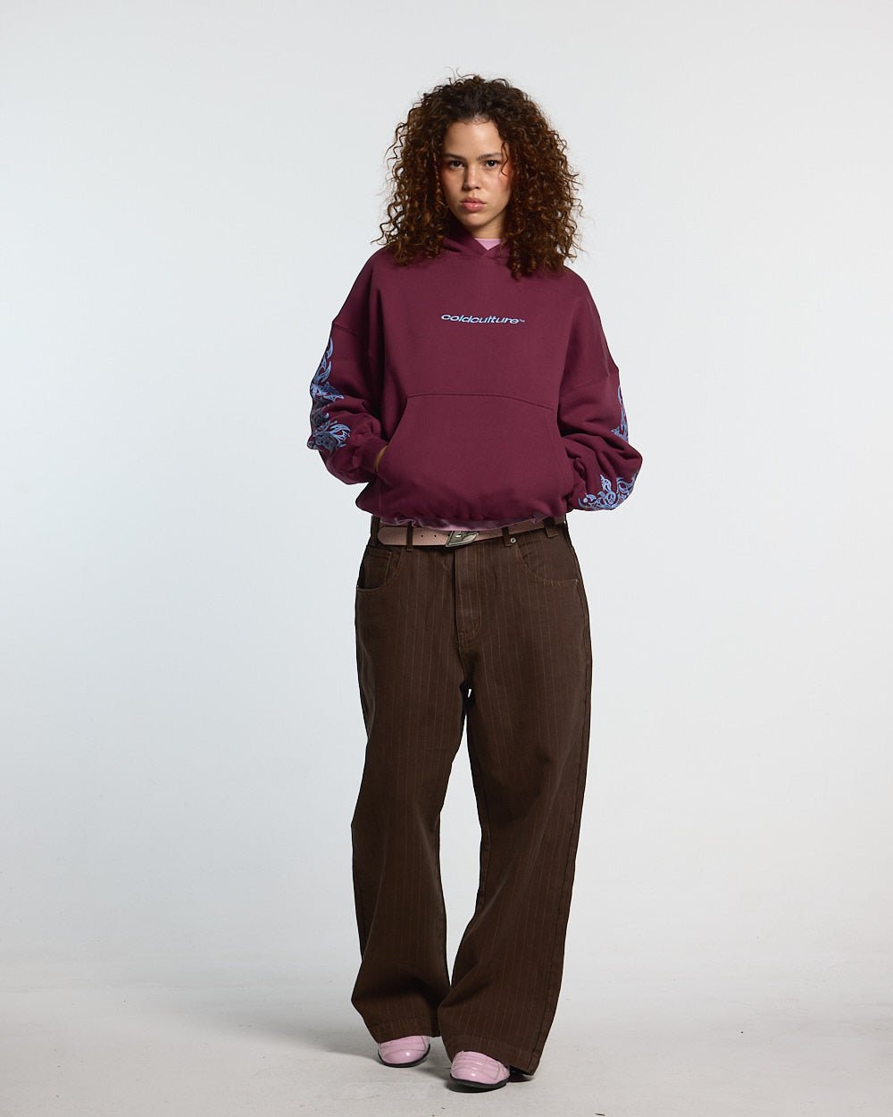 TRIBAL HOODIE BURGUNDY - burgundy tribal print hoodie, front view on female model - Cold Culture #woman