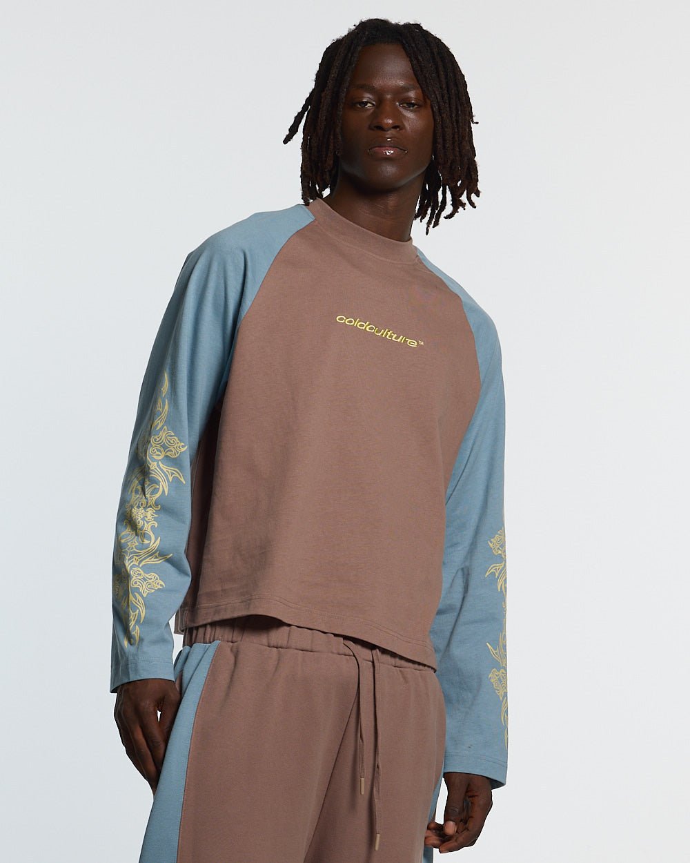 TRIBAL LONGSLEEVE BROWN & BLUE - brown and blue tribal longsleeve tee, front view on male model - Cold Culture #man
