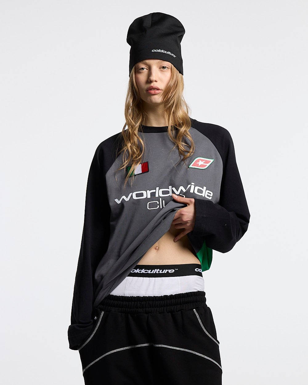 TRICOLORE LONGSLEEVE BLACK - black football-style longsleeve tee, front view on female model - Cold Culture #woman