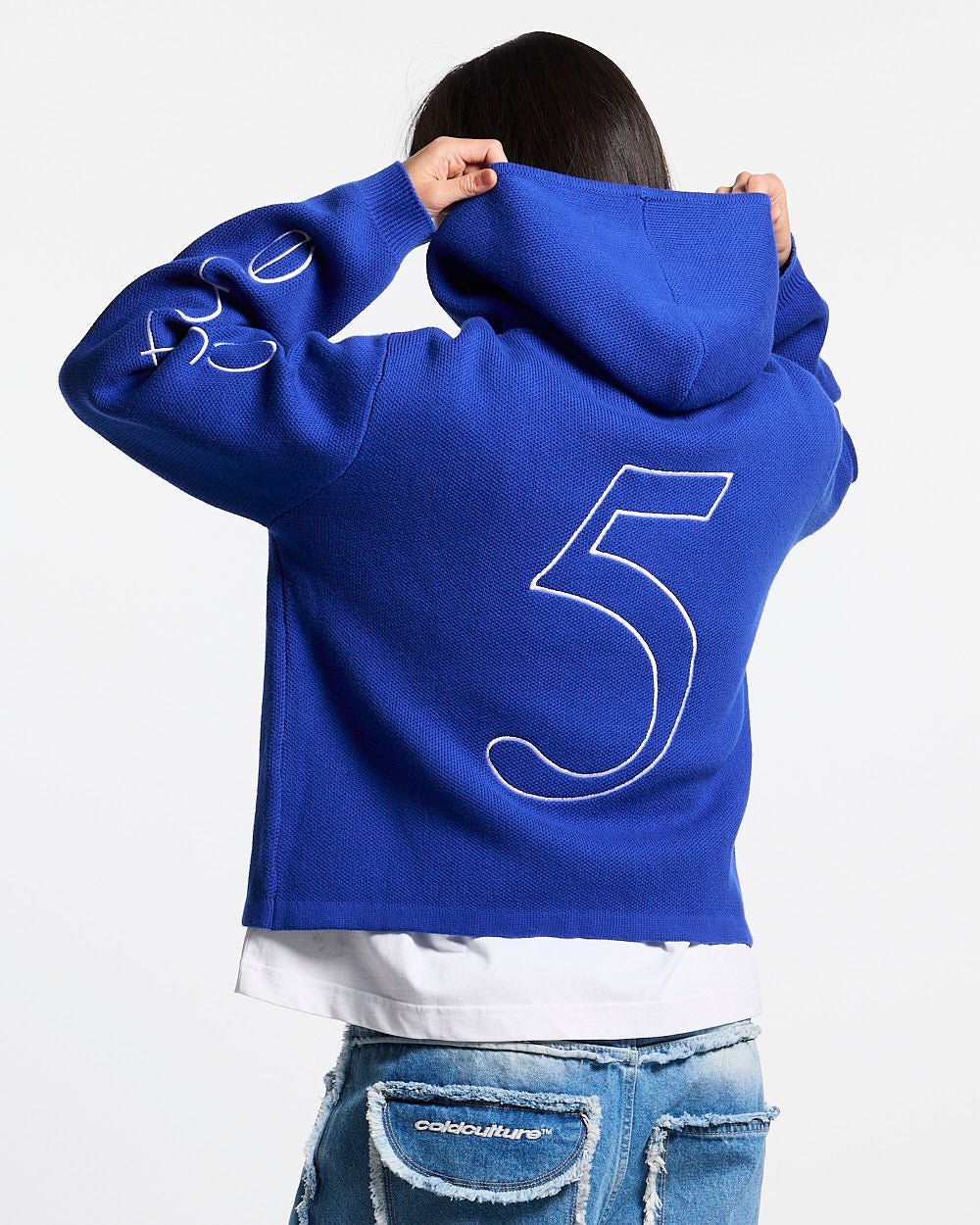 TRIPPY STOP ZIP KNIT BLUE - cobalt blue zip-up knit sweater, back view on female model - Cold Culture #woman