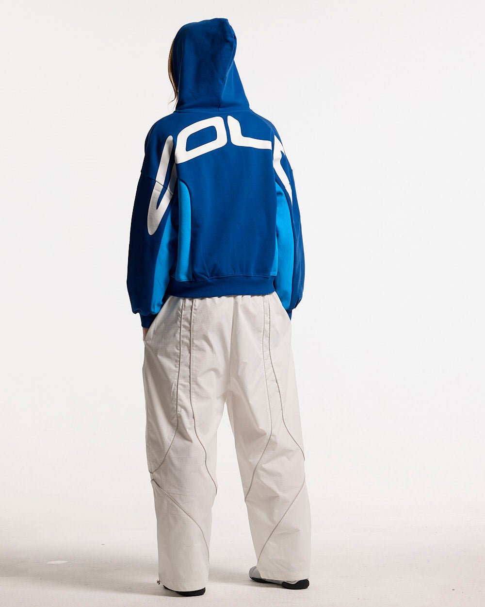 TWISTTER ZIP HOODIE BLUE - blue zip-up hoodie, back view on female model - Cold Culture #woman