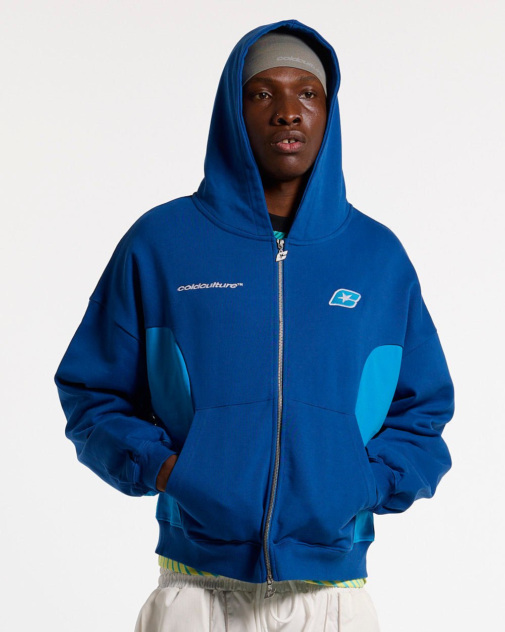 TWISTTER ZIP HOODIE BLUE - blue zip-up hoodie, front view on male model - Cold Culture #man