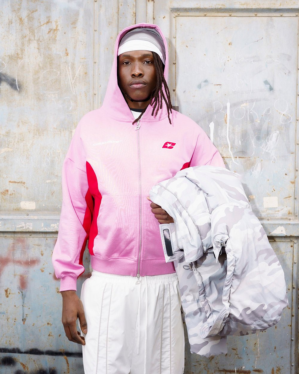 TWISTTER ZIP HOODIE PINK - pink and red zip-up hoodie, street style shot - Cold Culture