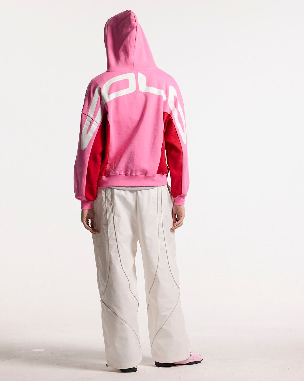 TWISTTER ZIP HOODIE PINK - pink and red zip-up hoodie, back view on female model - Cold Culture #woman