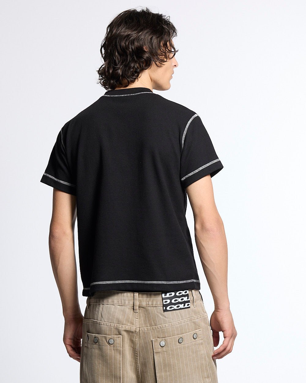 UNDERSKIN TEE BLACK - black contrast stitch tee, back view on male model - Cold Culture #man