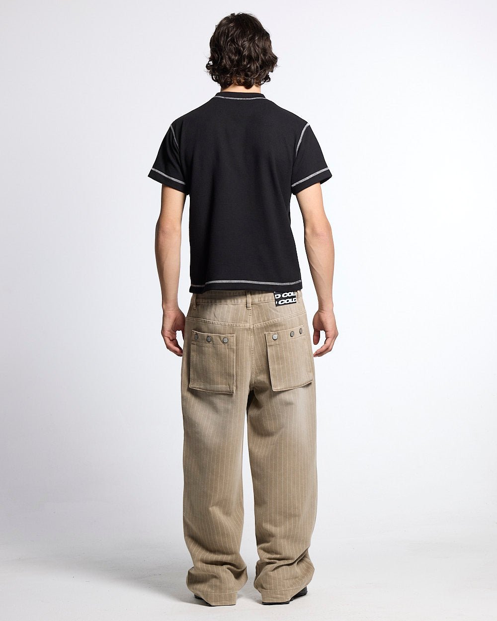 UNDERSKIN TEE BLACK - black contrast stitch tee, back view on male model - Cold Culture #man