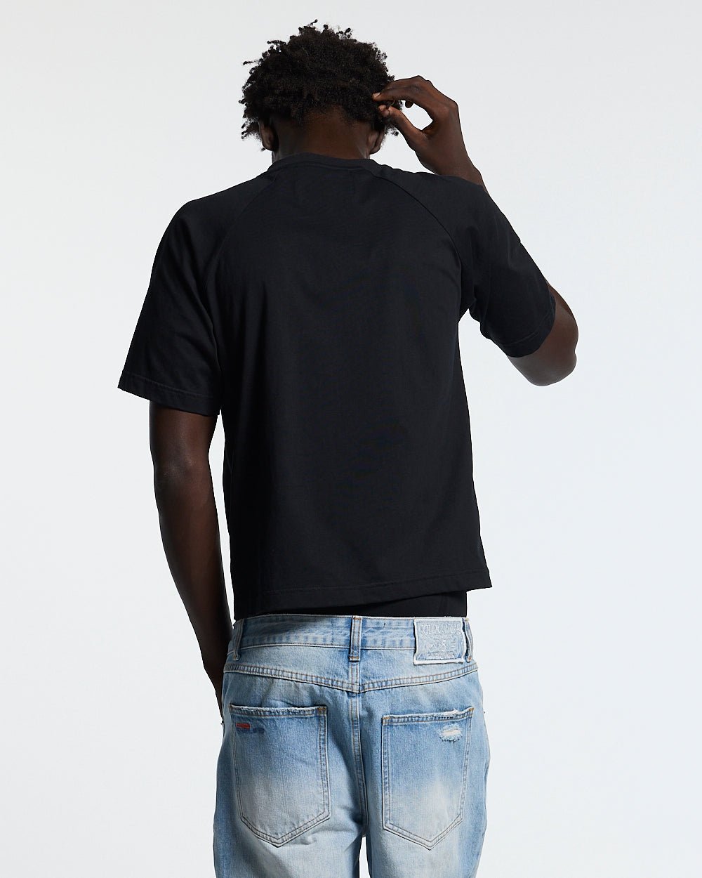 UNIT 05 TEE BLACK - black buttoned shoulder tee, back view on male model - Cold Culture #man