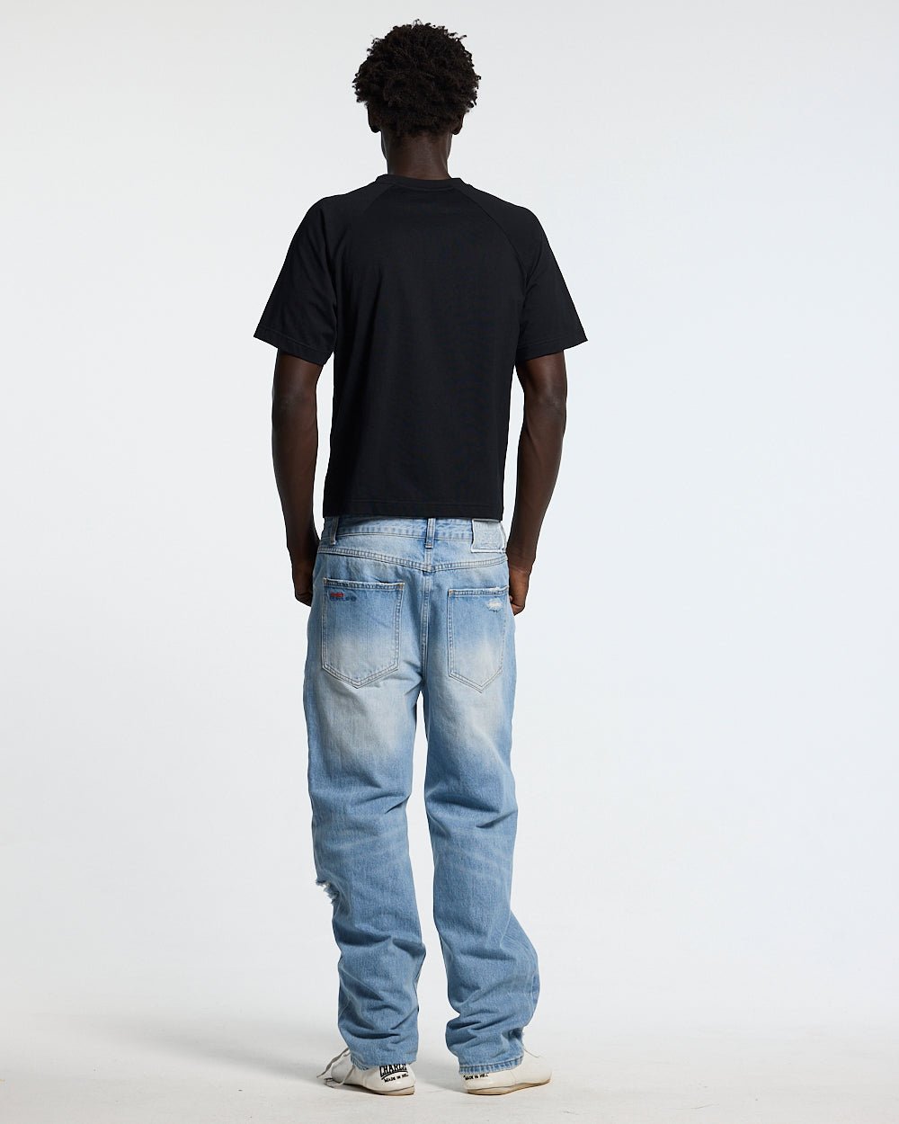 UNIT 05 TEE BLACK - black buttoned shoulder tee, back view on male model - Cold Culture #man