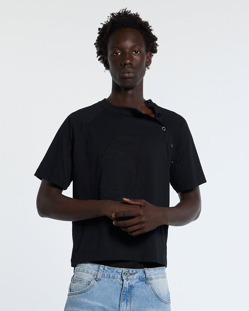 UNIT 05 TEE BLACK - black buttoned shoulder tee, front view on male model - Cold Culture #man